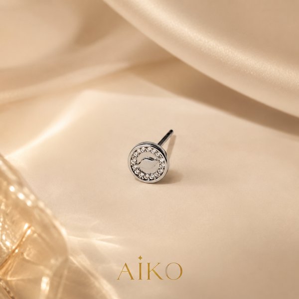 Aretes plateados circulares con brillos