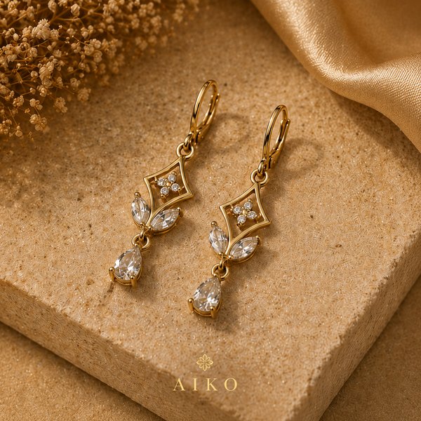 Aretes dorados con cristales y forma de angel