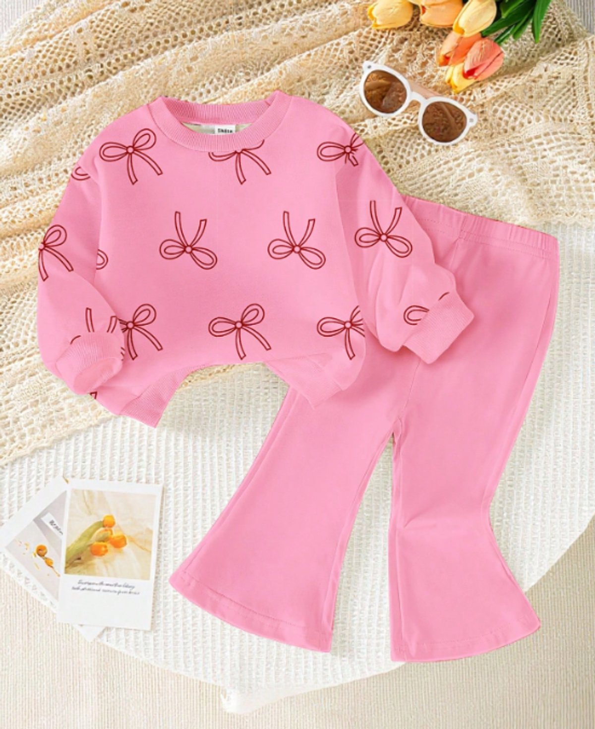Conjunto rosa con buzo estampado
