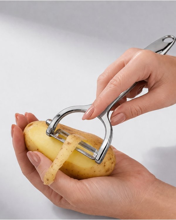 Pelador manual de acero inoxidable para papas, zanahorias y verduras.