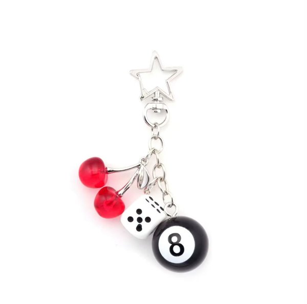 Llavero con estrella, cerezas, dado y bola 8