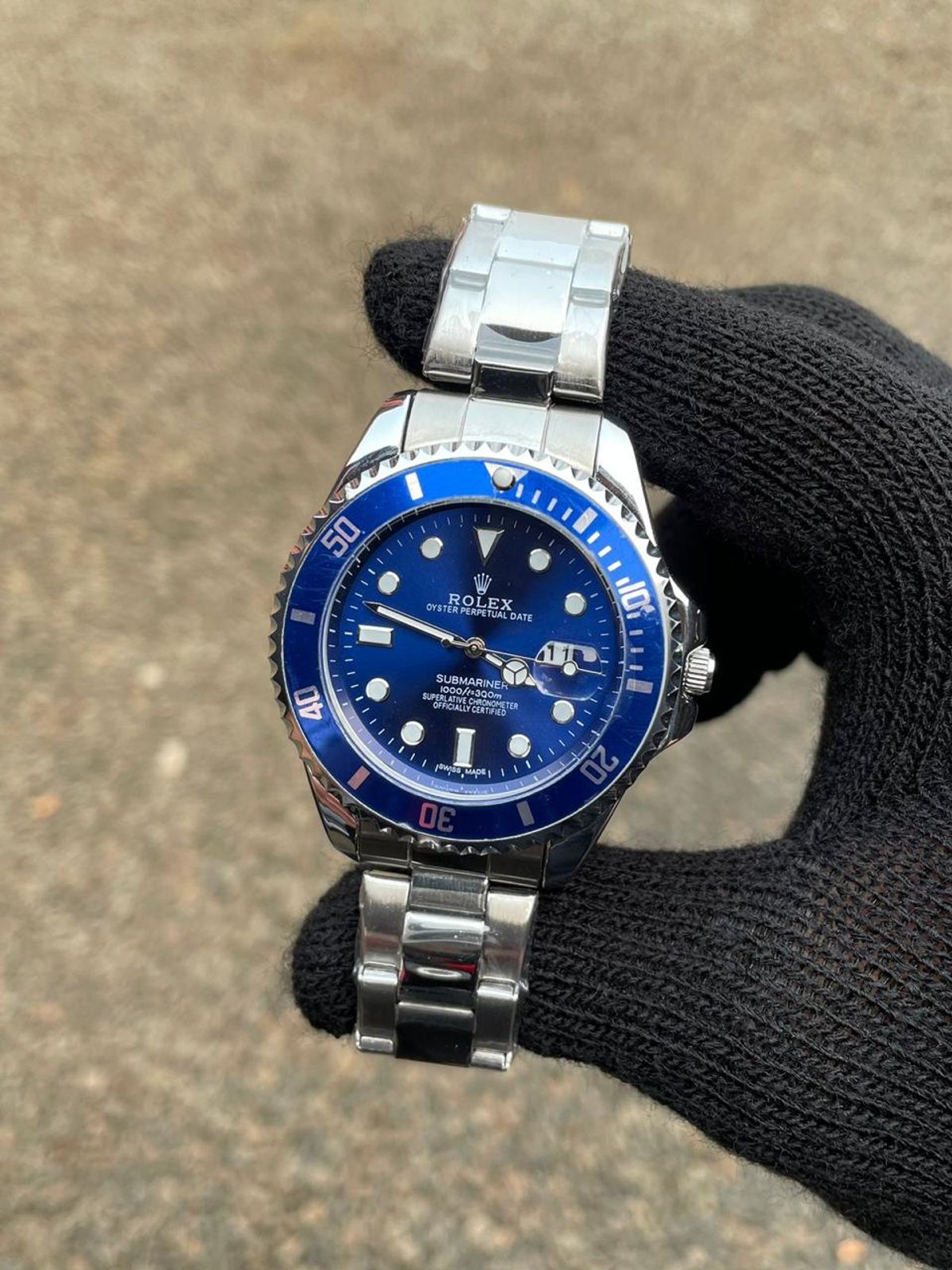 Rolex Submariner Plateado Fondo Azul