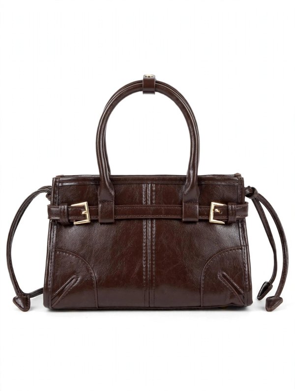 Cartera negra con hebillas decorativas